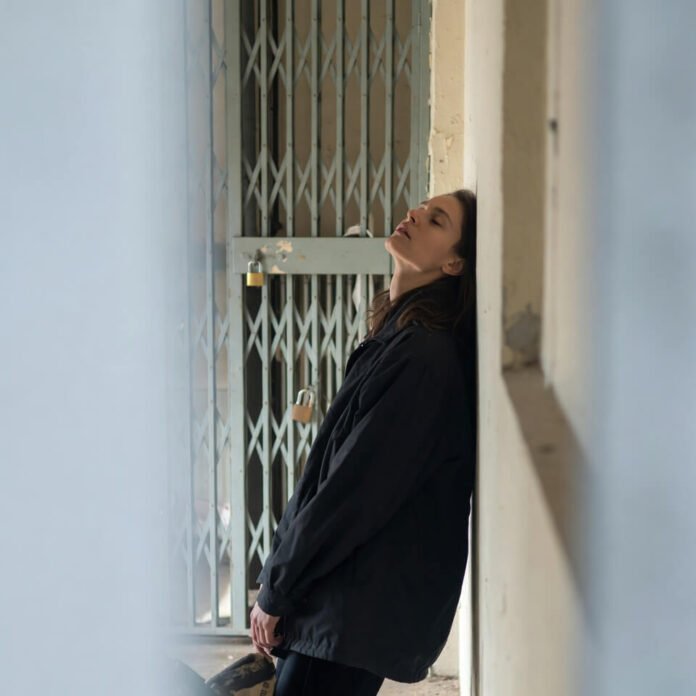 Slumped traveler in airport gate area, casual phone snap.