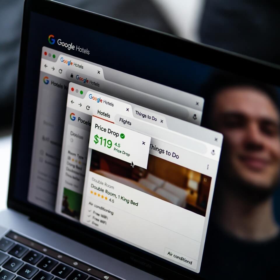 Laptop screen with Google Hotels price drop alert